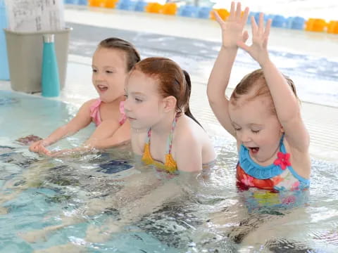 a group of girls in a pool
