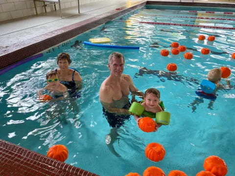 a group of kids in a pool