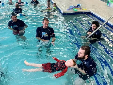 a group of people in a pool