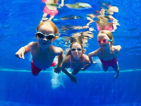 a group of kids in a pool