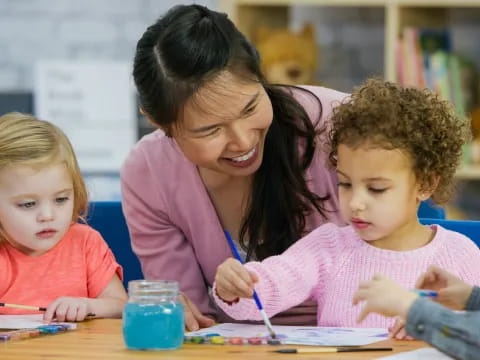 a person and children painting