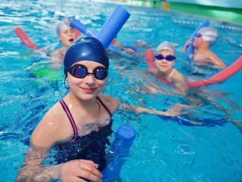 a group of people in a pool