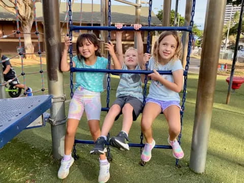 a group of girls on a swing