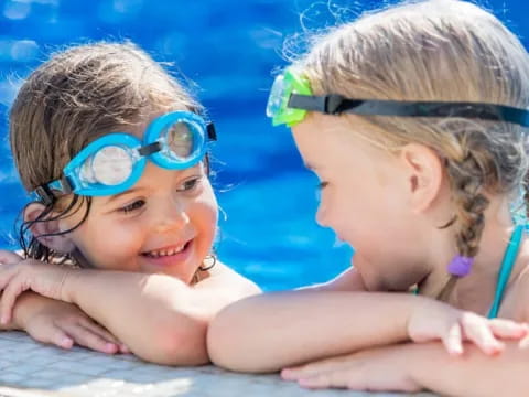 a couple of girls in a pool