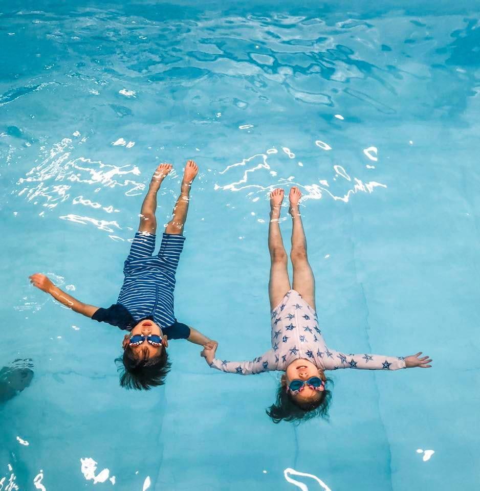 a couple of people in a pool
