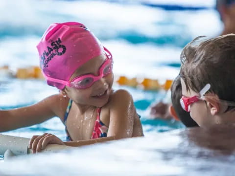 a couple of girls in a pool