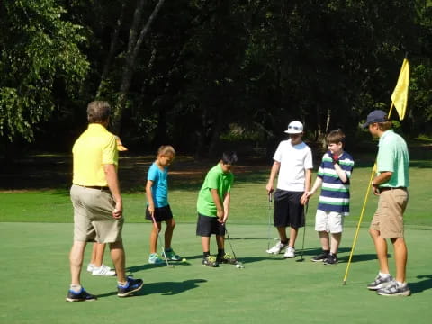 a group of people playing golf