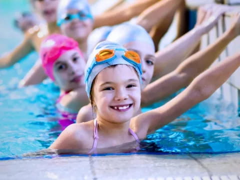 a group of people in a pool