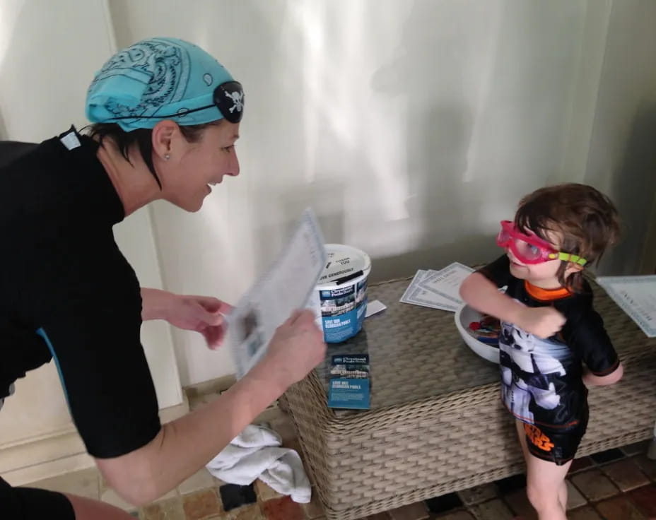 a person and a child with a toy