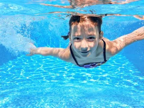 a person swimming in a pool