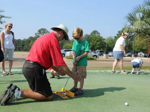 a group of people playing golf