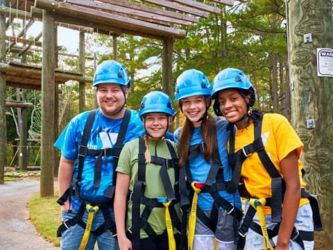 a group of people wearing helmets