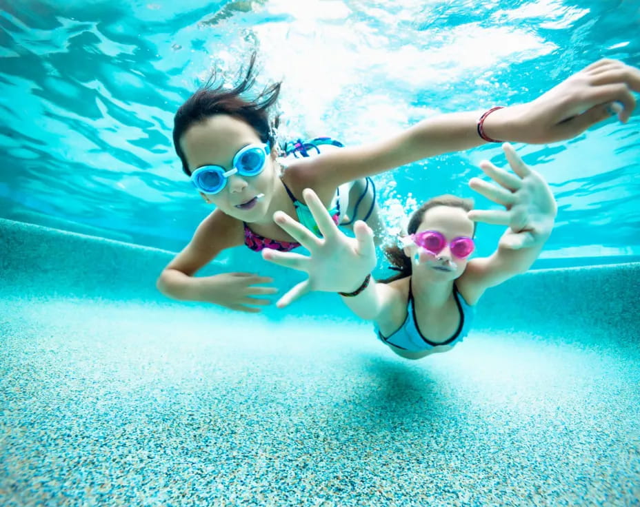 a man and woman in a pool