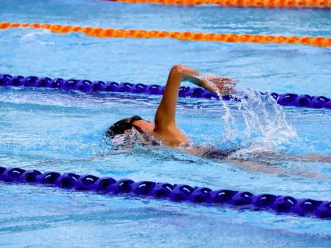 a person swimming in a pool