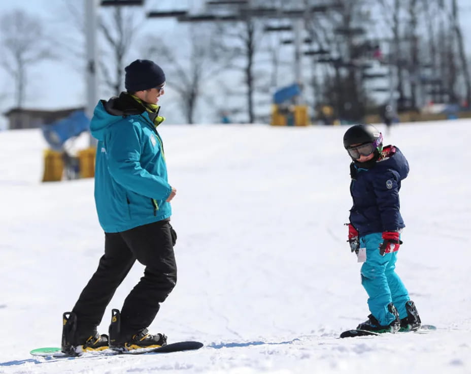 a person and a child skiing
