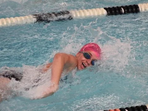 a person swimming in a pool