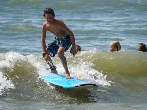 a boy riding a surfboard