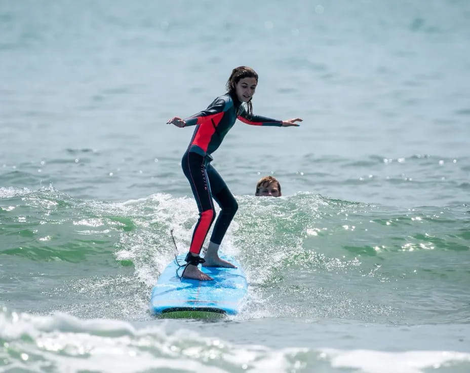 a man riding a surfboard