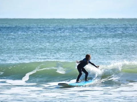 a person surfing on the waves