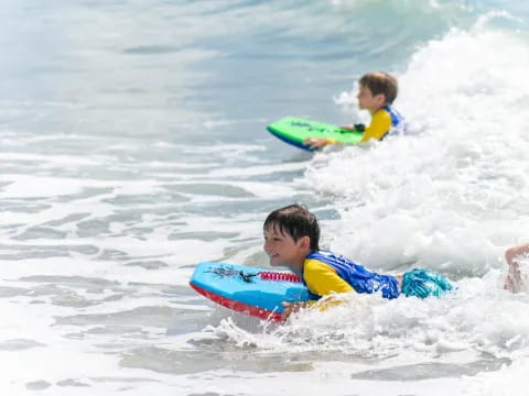 kids playing in the ocean