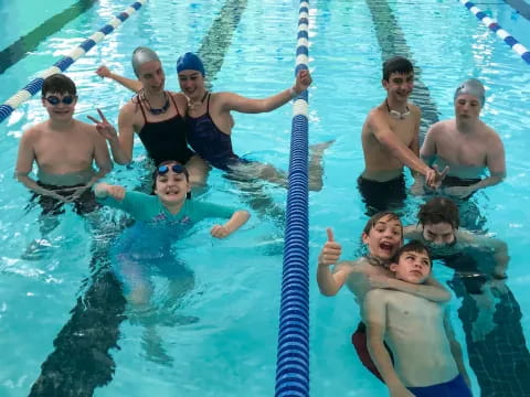 a group of people in a pool