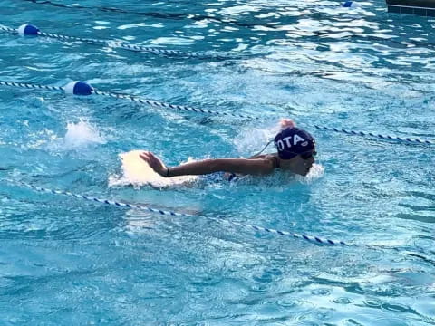 a person swimming in a pool