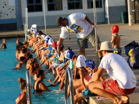 a group of people in a pool