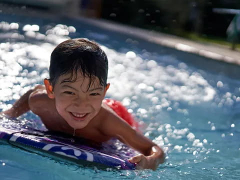 a boy in a pool