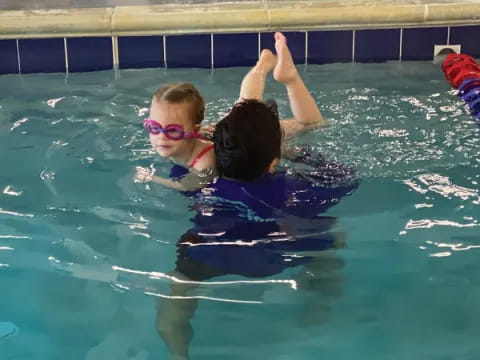 a man and a woman in a pool