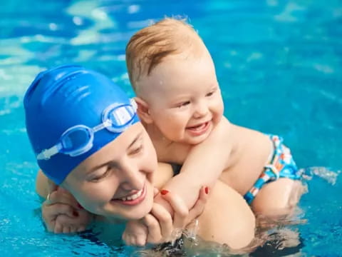a couple of babies in a pool