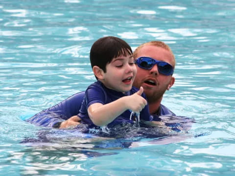 a man and a boy in the water