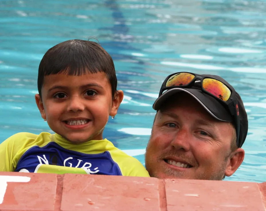 a person and a boy in the water
