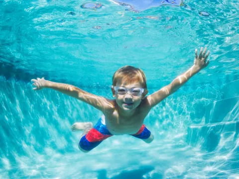a boy in a pool
