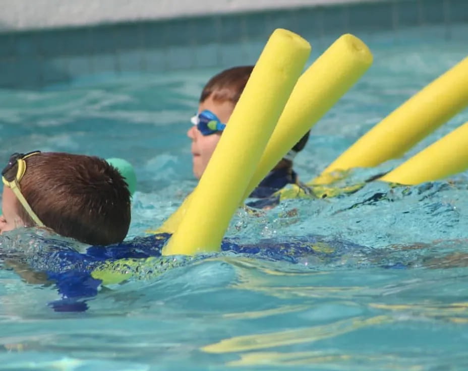 a group of people in a pool