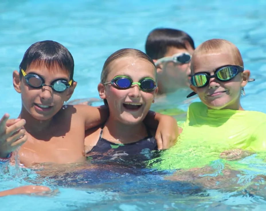 a group of kids in a pool