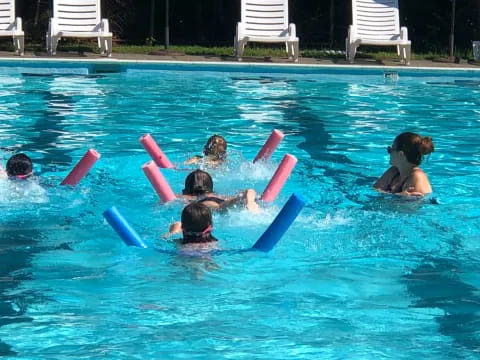 a group of people in a pool