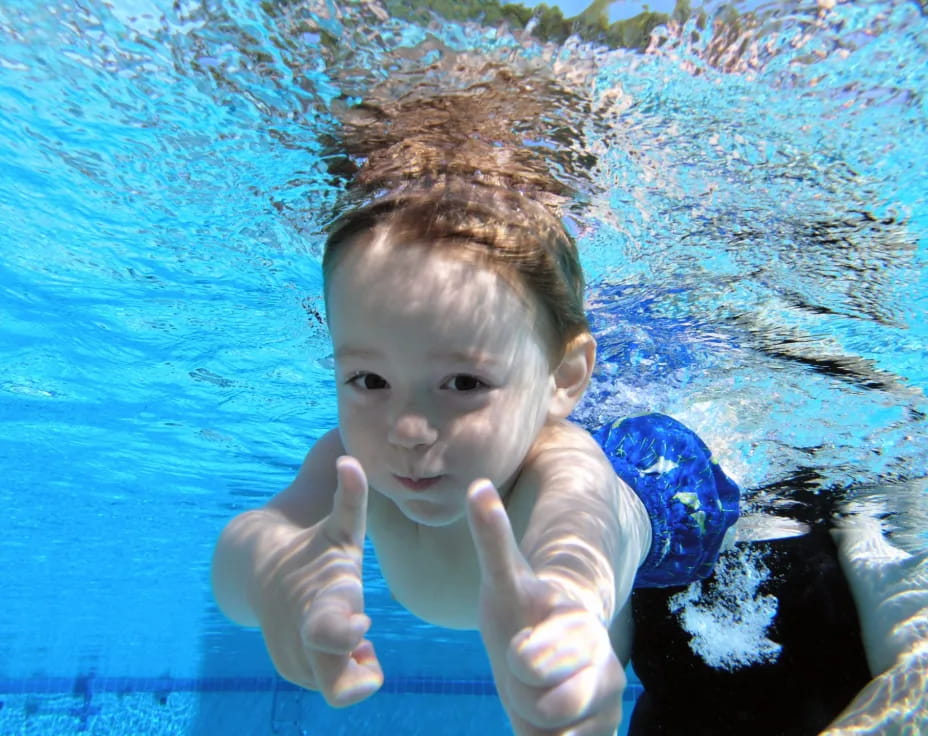 a baby in a pool