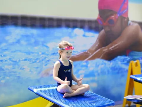 a person and a girl in a pool