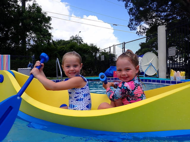 two kids in a pool