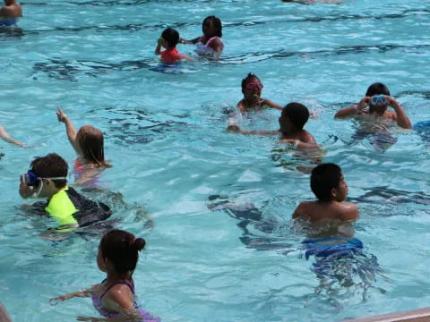 a group of people in a pool