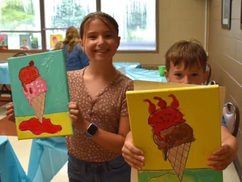 a person and a boy holding up colorful paper bags