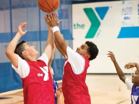 a group of men playing basketball