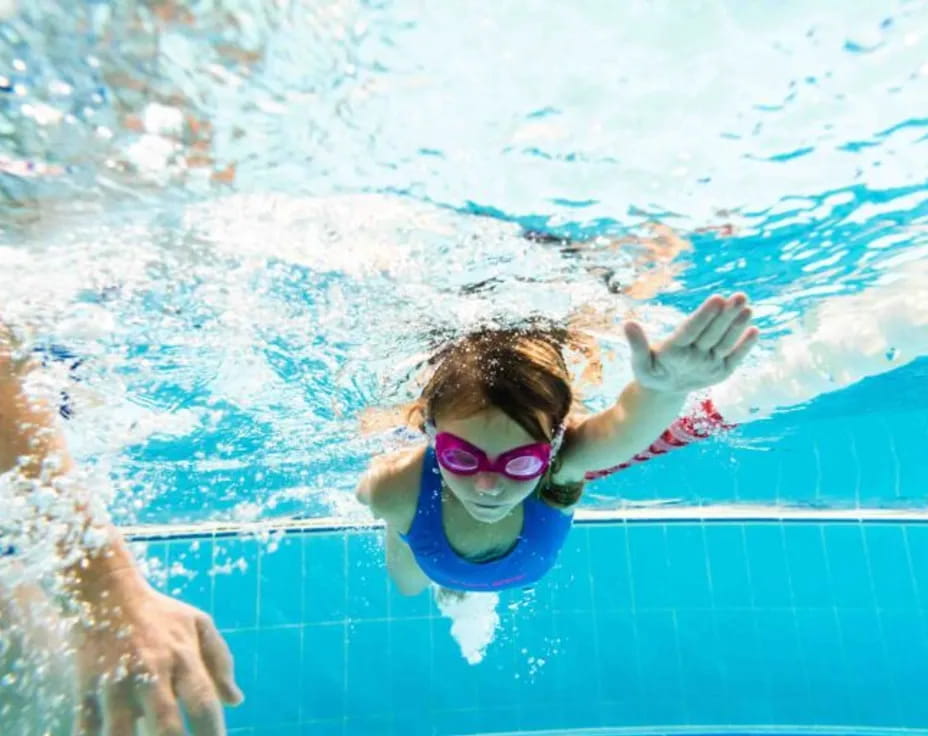 a person swimming in a pool