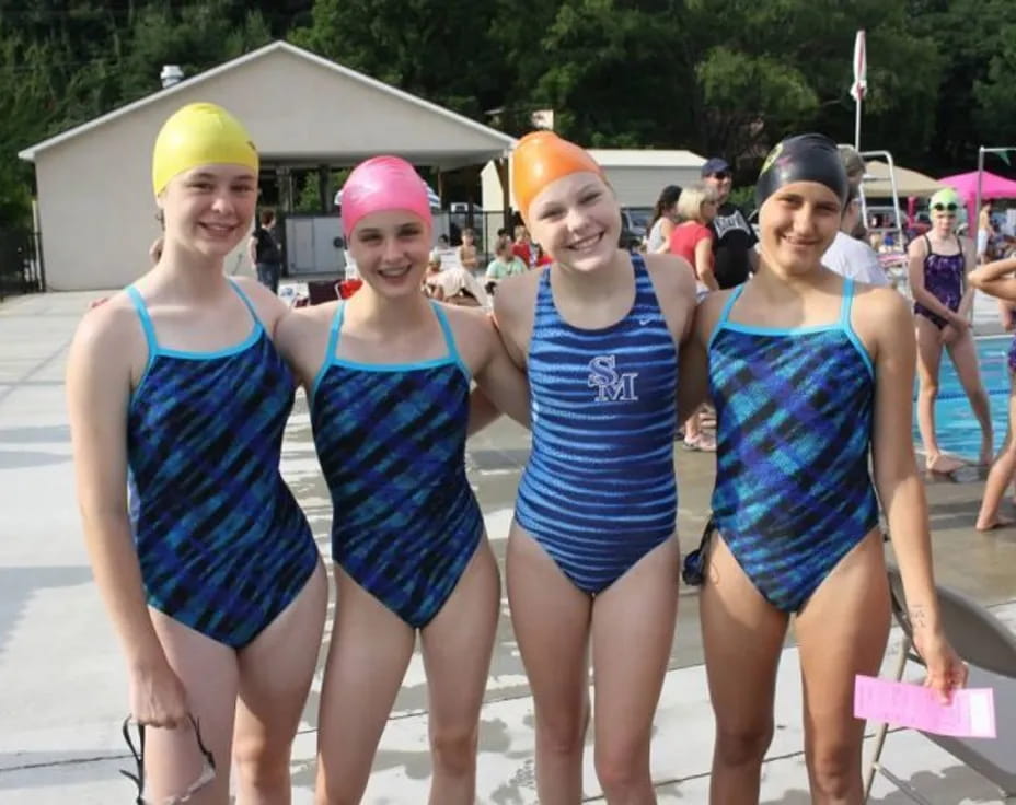 a group of women wearing clothing