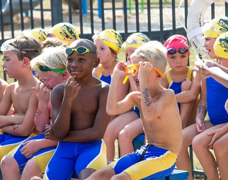 a group of people in swimsuits