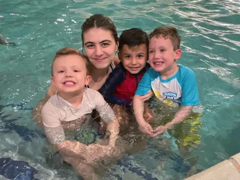 a group of children in a pool