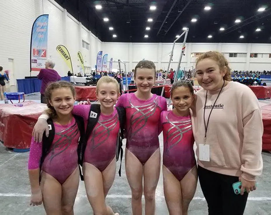 a group of women posing for a photo