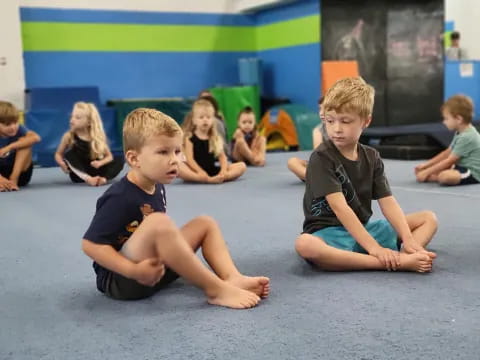 a group of children sitting on the floor