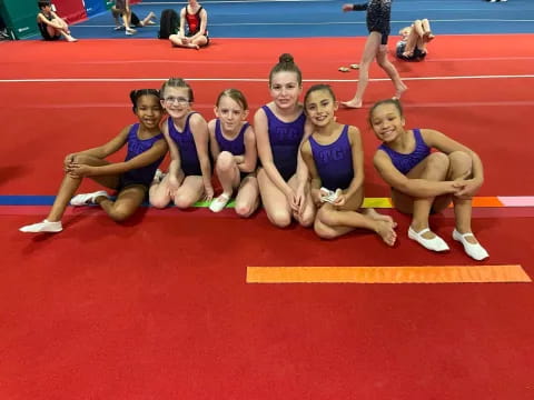 a group of women in blue uniforms