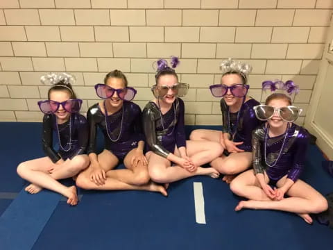 a group of kids wearing clothing